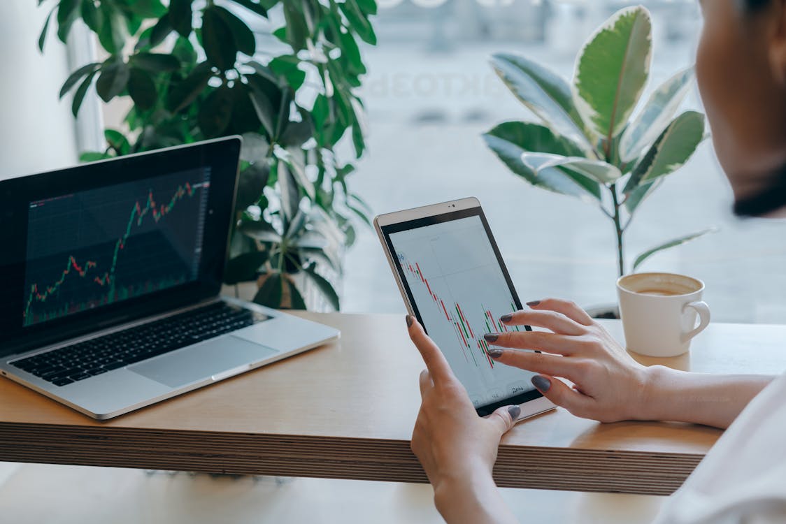 Business person using tablet for tracking