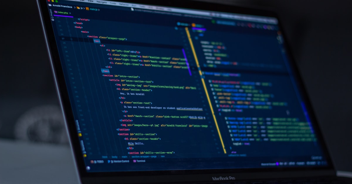 Developer using voice commands and AI to generate code on screen without touching the keyboard